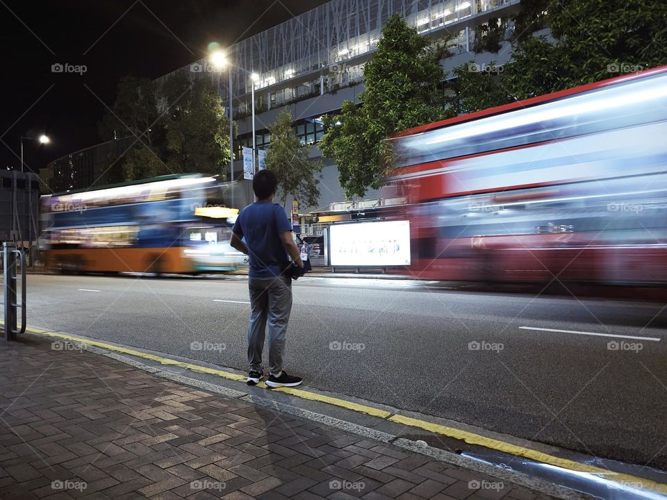 Man waiting to cross the street