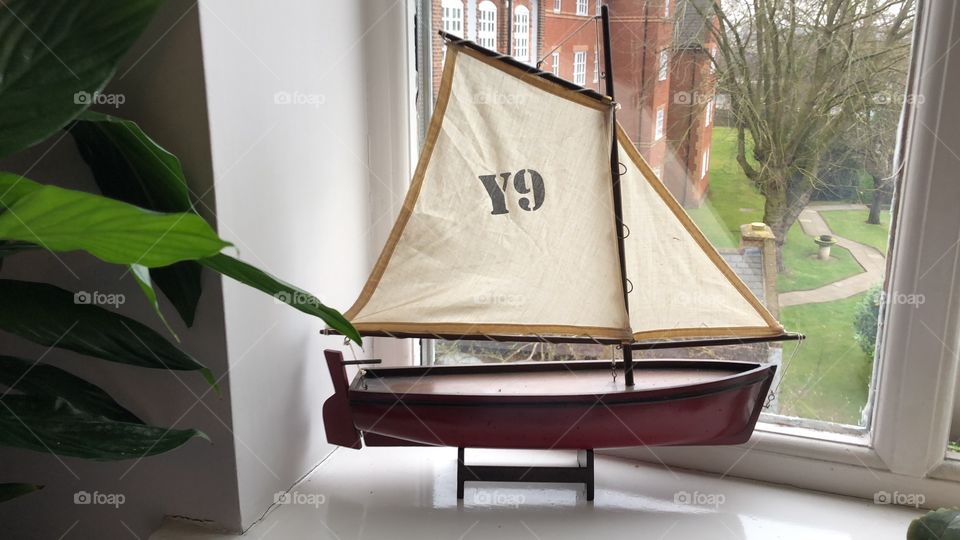 Model Sailboat on Windowsill 