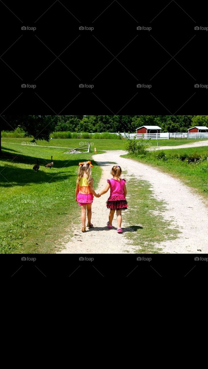 Little girls holding hands