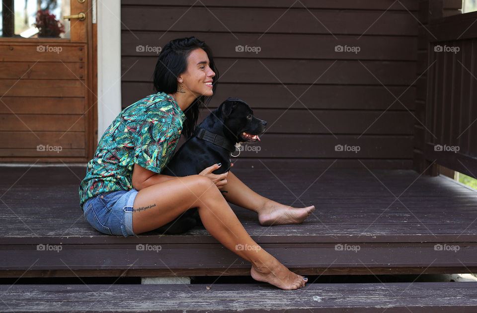 girl with her dog, in a country house, in the country, social distance, walks outside the city, together, together.  quarantine time