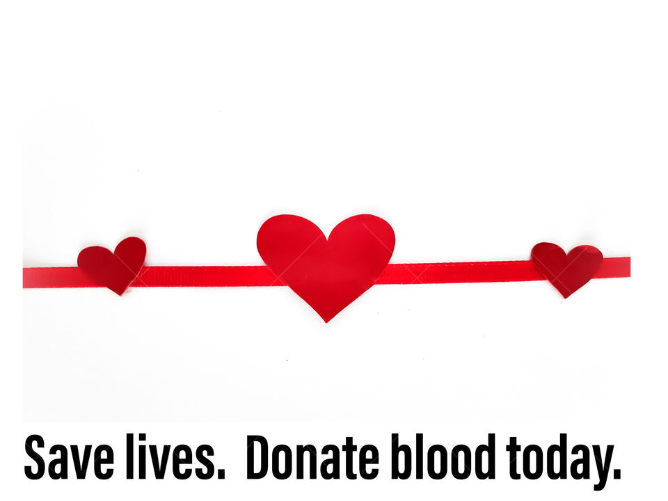 Flatlay: Three red hearts connected by a red ribbon on a white background with Black text: Save lives. Donate blood today.