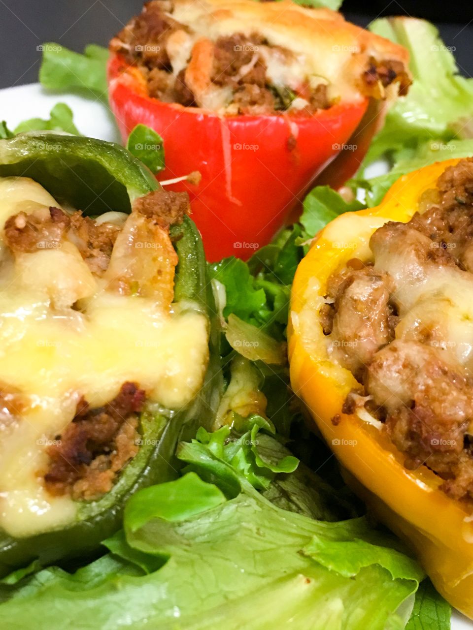 Stuffed bell peppers capsicum green yellow and red closeup food 