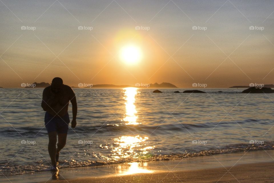 coming out of the water, sunset