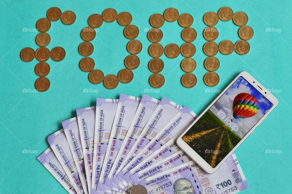 The FOAP word is formed using Indian ₹5 gold coins.The picture explains about making money using Foap app.Even Indians earning money through the Foap app😍😍