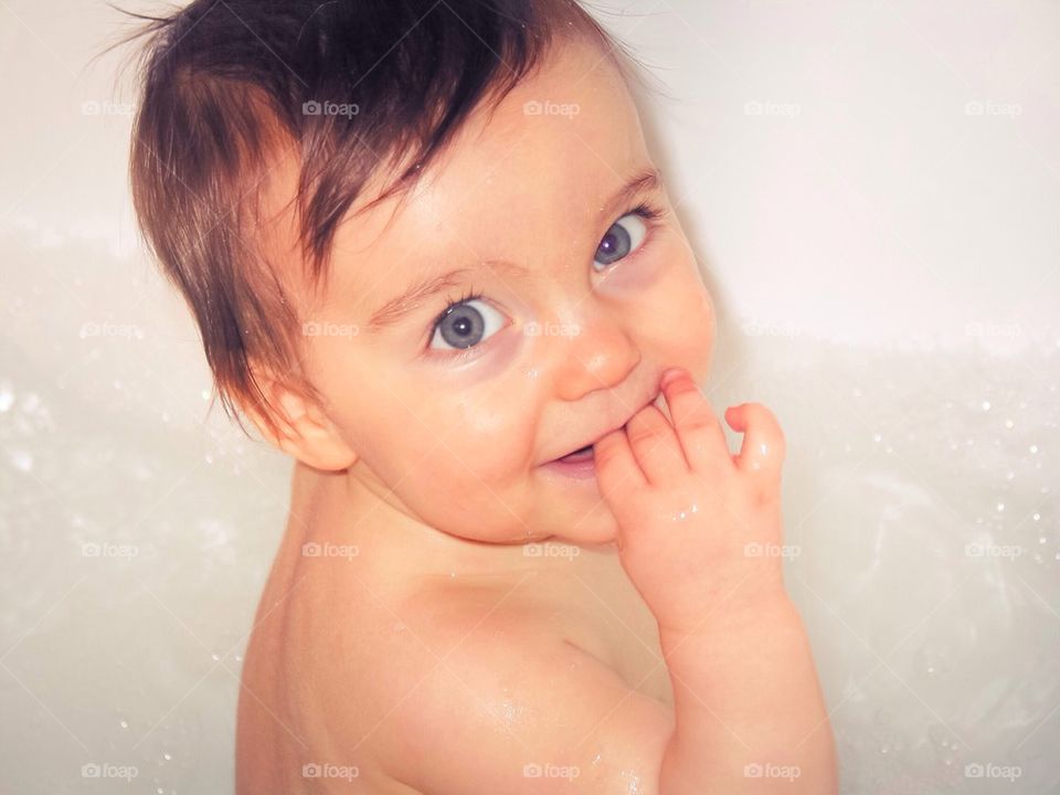 Baby boy taking a bath