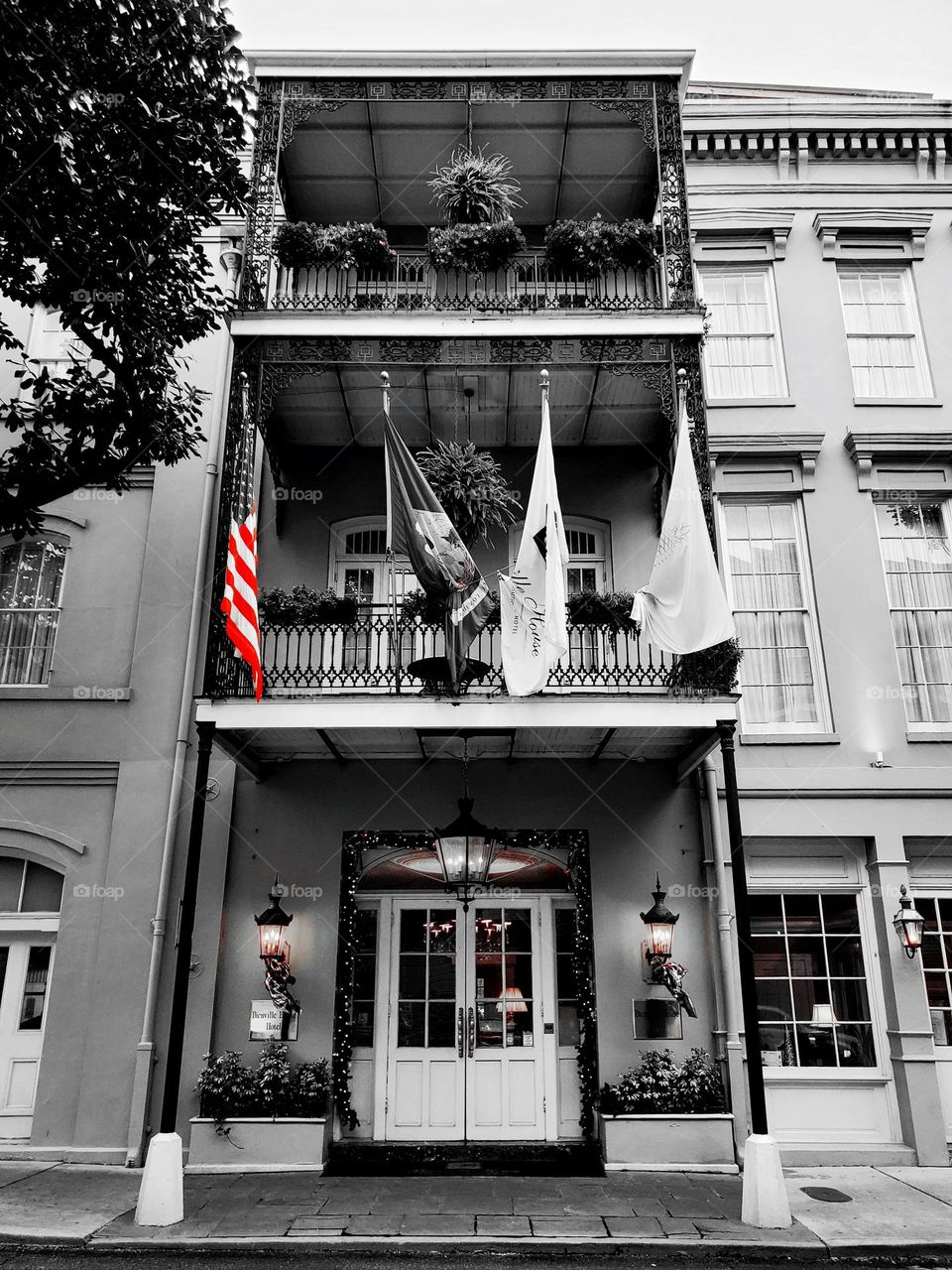A old building is beautifully preserved and proudly flies the American flag
