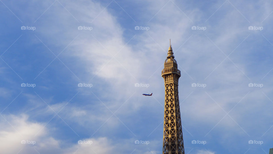 Eiffel tower and passenger jet plane