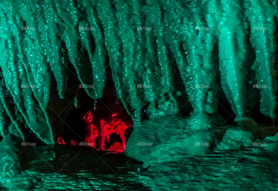 Cave structures lit up with blue/green and red lighting. The red area stands out, like an angry, but comically demonic face.