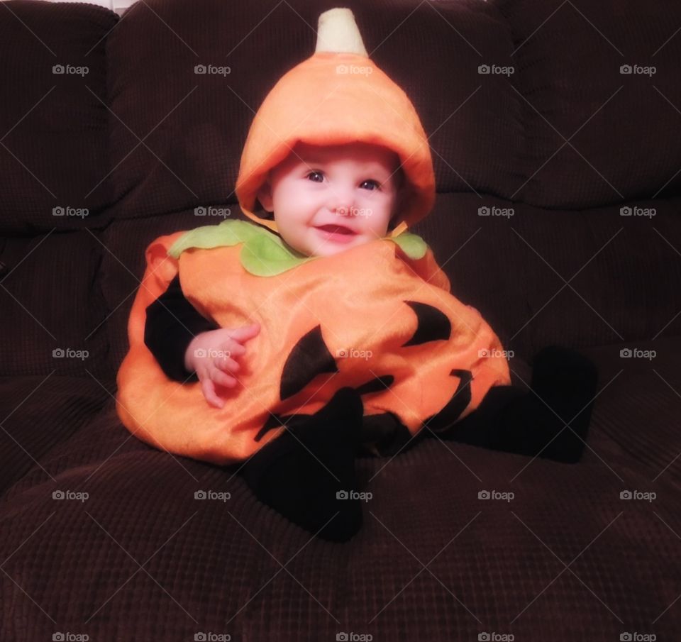 Baby dressed up as a pumpkin for Halloween!