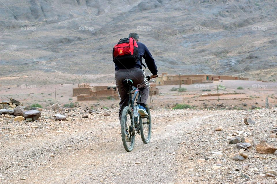 Cycling trip through the mountain road on a hard track