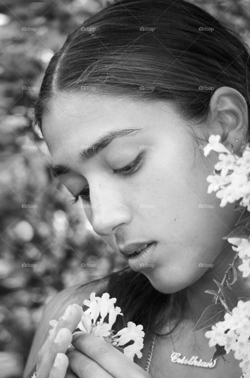 Beautiful girl with white flowers, portrait