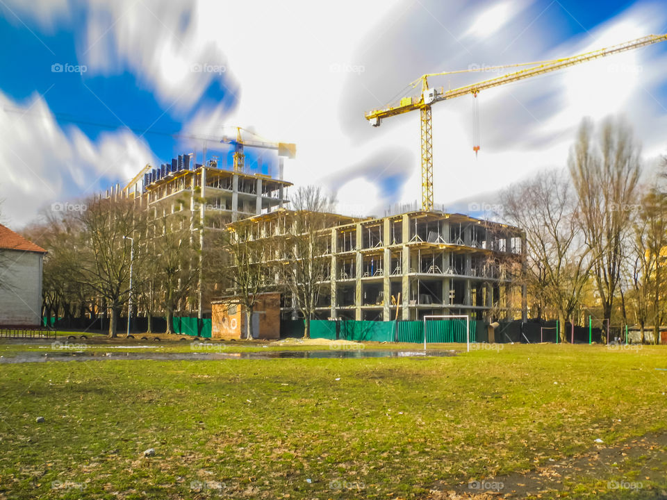 building process with crane on long exposure