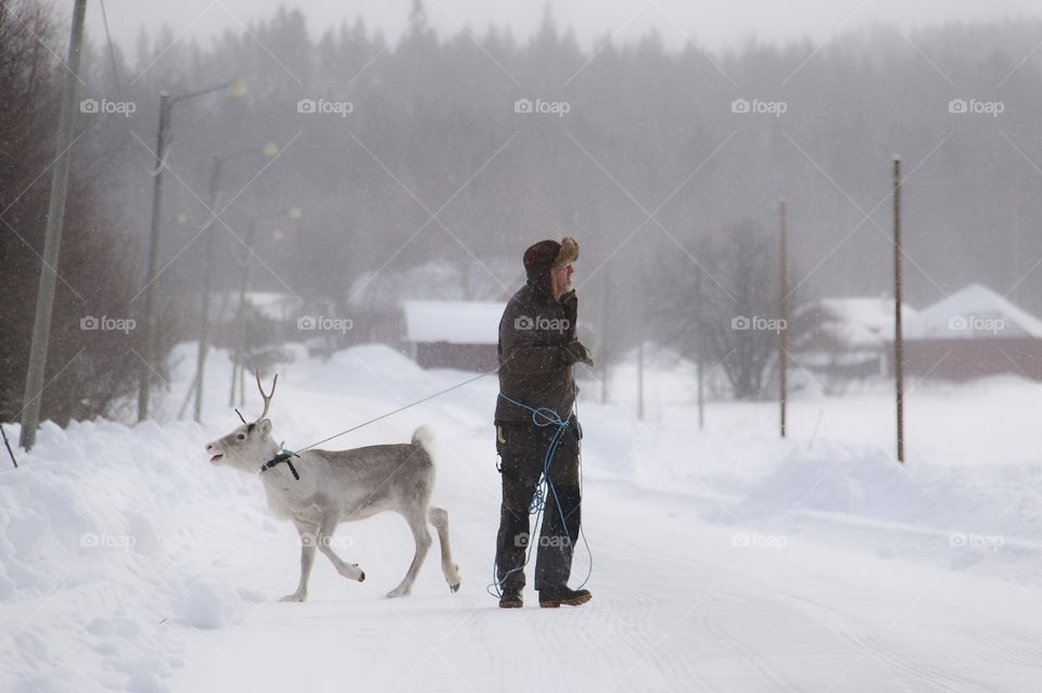 old man with reindeer