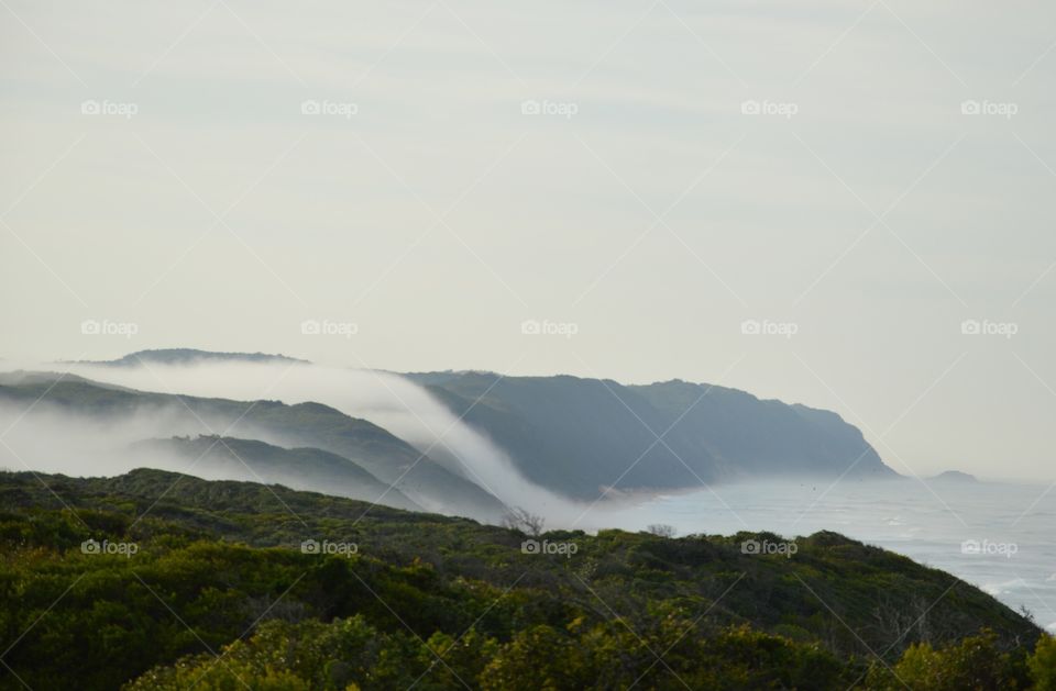 Scenic view of mountains at fogy weather