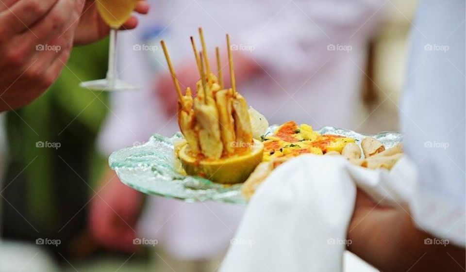 Appetizers being passed around at a party  