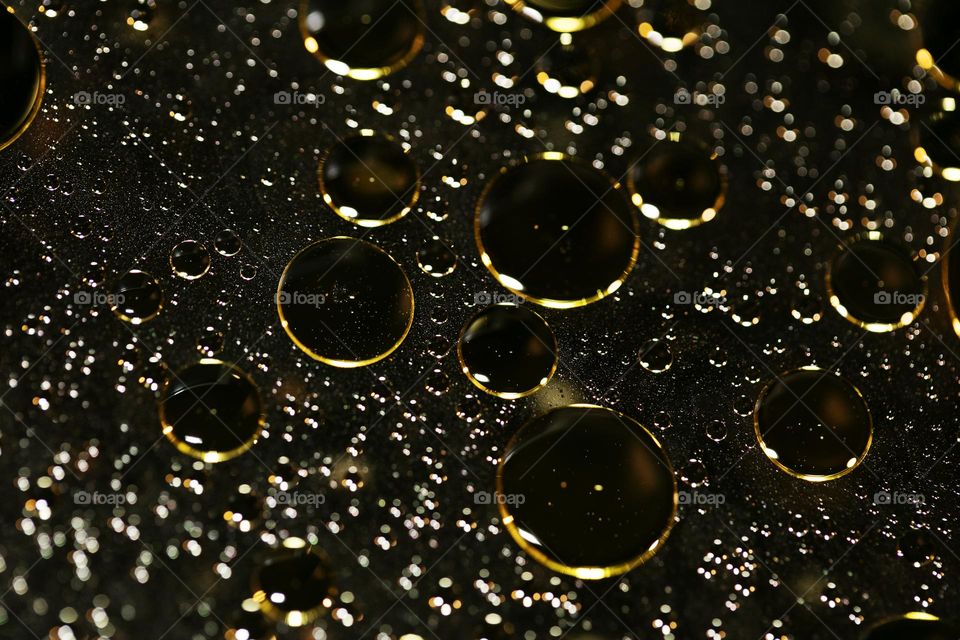 Golden oil Bubbles Close Up background amazing colours droplets of life in black texture macro look summer mood positive vibes wonderful day hustling daydreaming