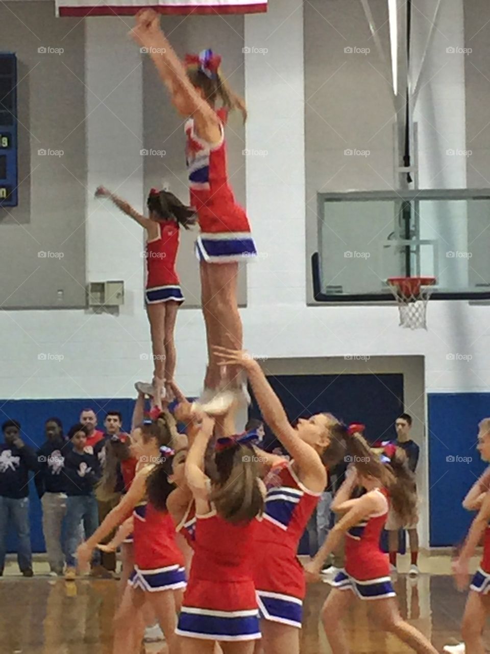 Girls dance during basketball match