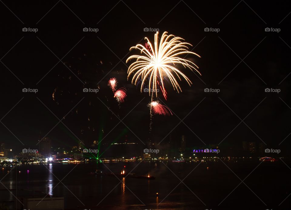 Illuminated fireworks in sky at night