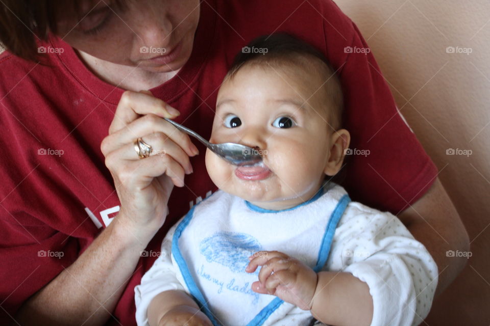 Mother feeding her son