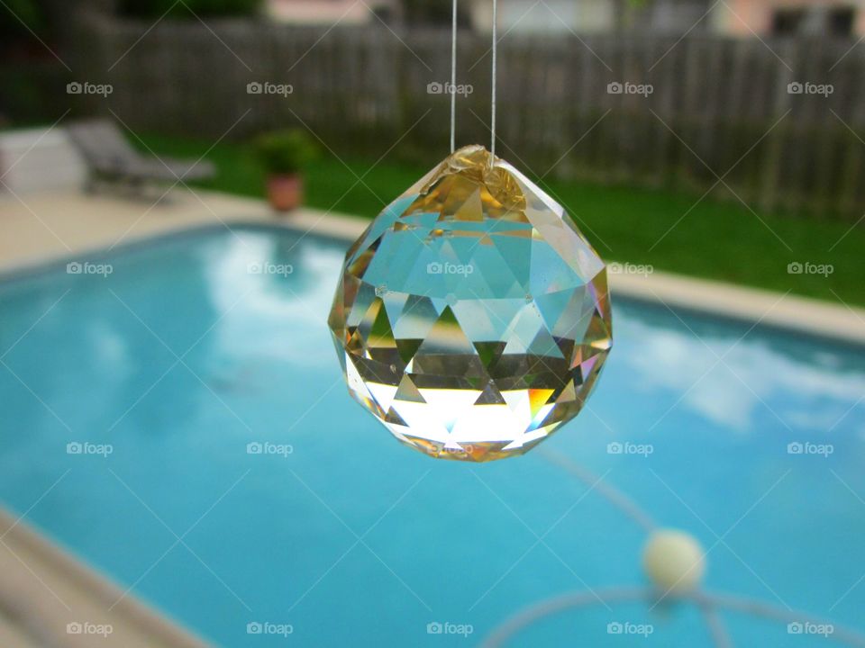 crystal ball. Poolside crystal, summertime swimming pool