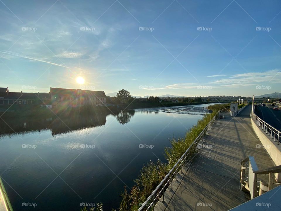 Sunny day by the lake litre trips in Europe Poland. Beautiful blue sky and water, few boats and kayaks by the shore. 