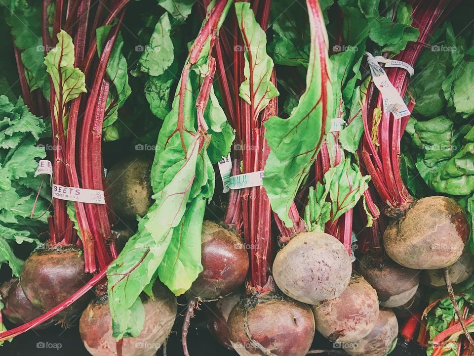 Red Beets on display at a farmers market. 