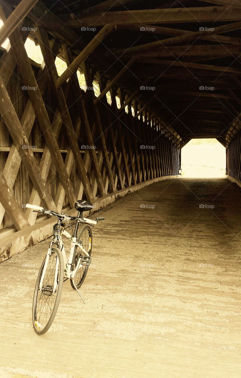 Biking. Bike Resting on a Covered Bridge