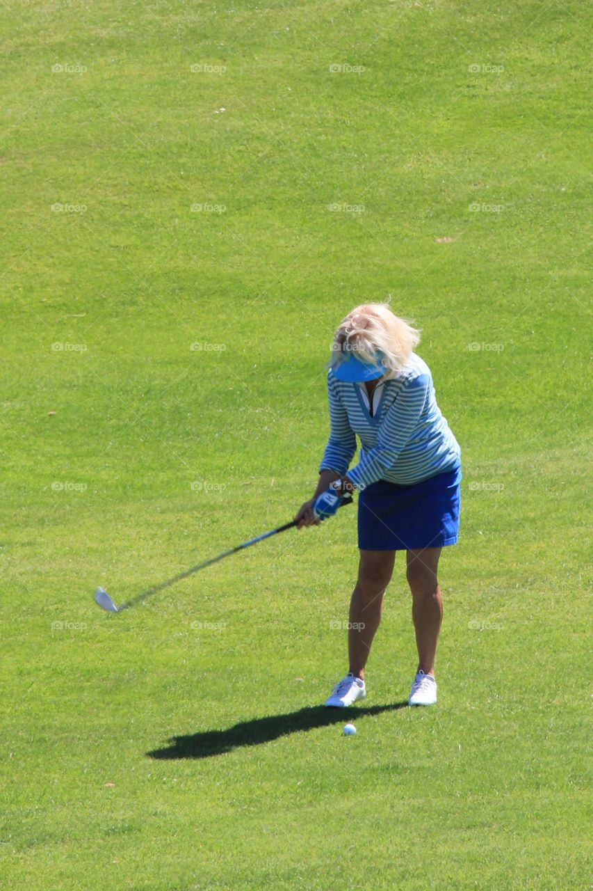 Playing golf in the summer