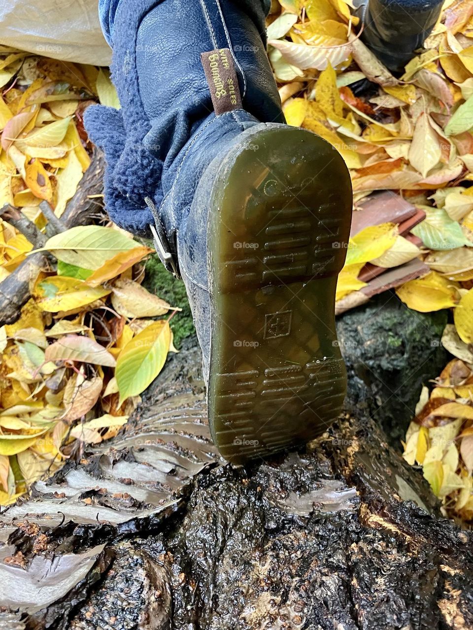 Clearing up the leaves wearing a pair of old Doc boots 