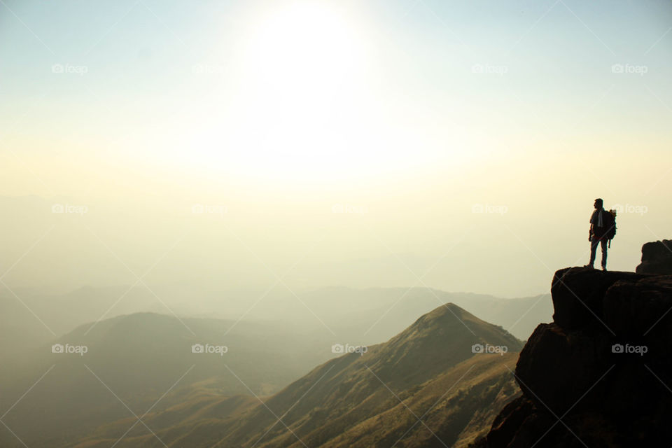 A person watching mountain range