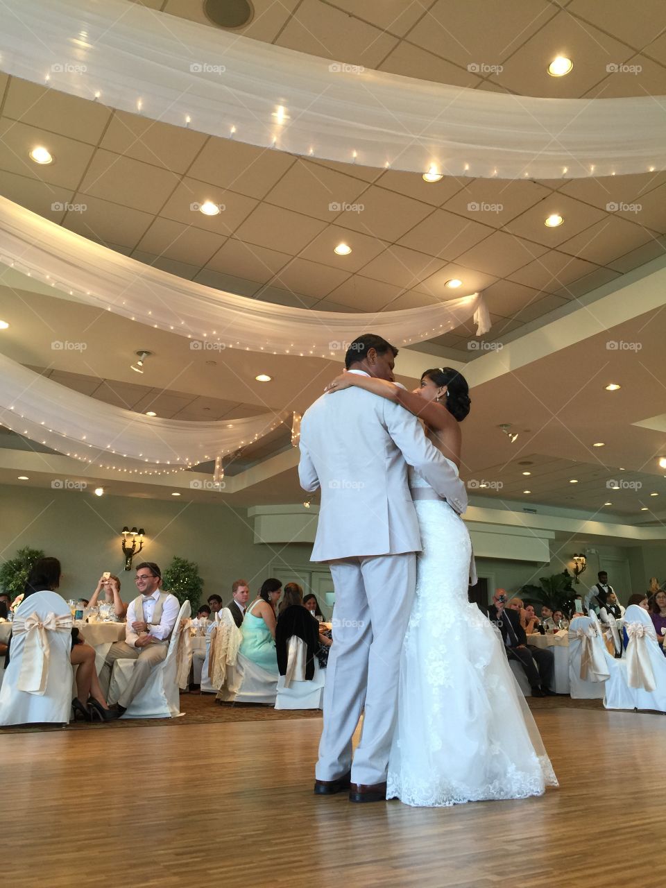 Wedding. Father and bride dancing in a party 