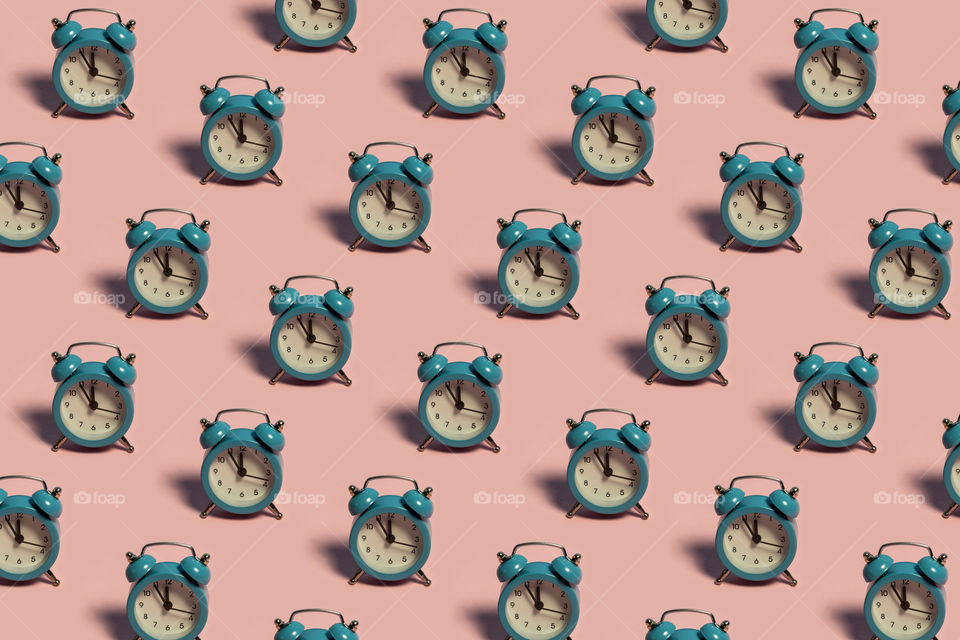 Pattern made of blue alarm clock