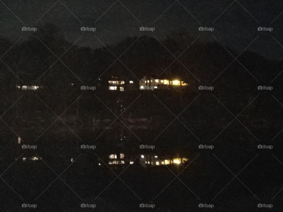 House across the lake at night