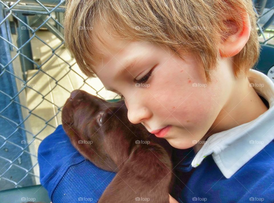 Boy With His Puppy. Unconditional Love