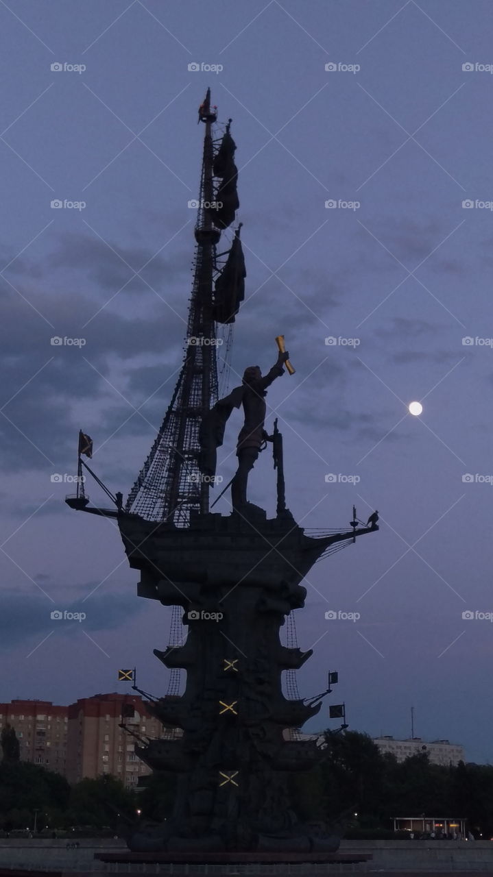 Monument to Peter the Great on the ship on the background of the full moon