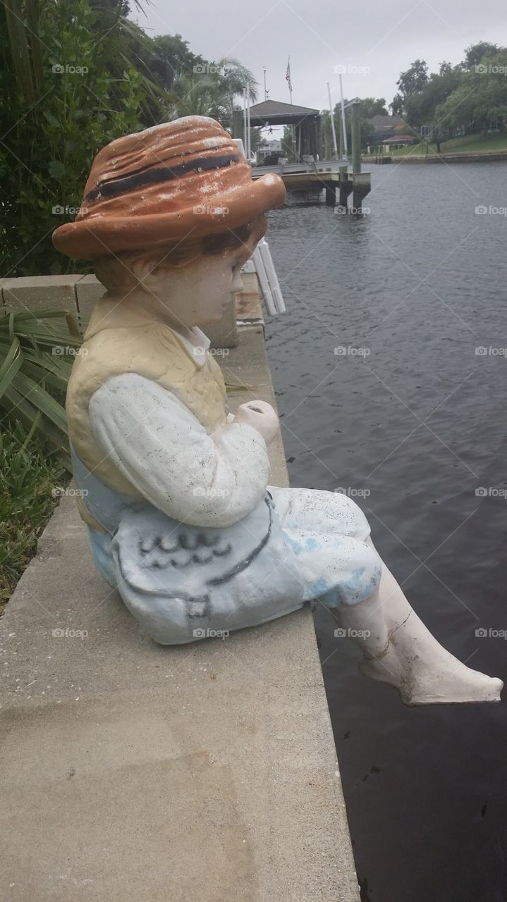 Fishing boy statue