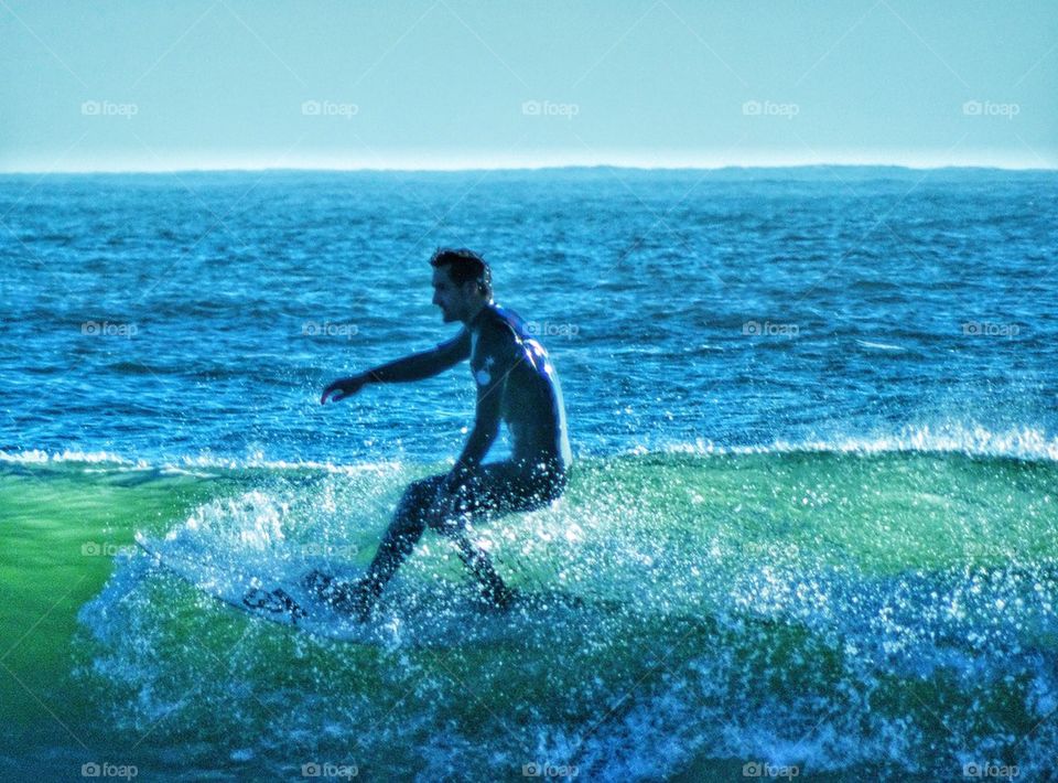 Surfer Riding Out A Wave. Epic Surfing
