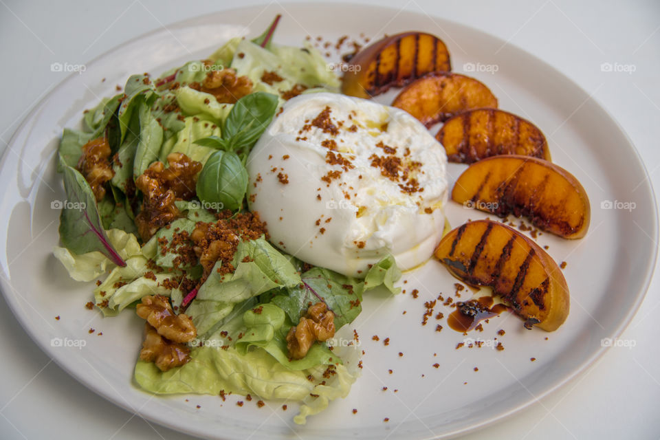 Burrata and grilled peach salad