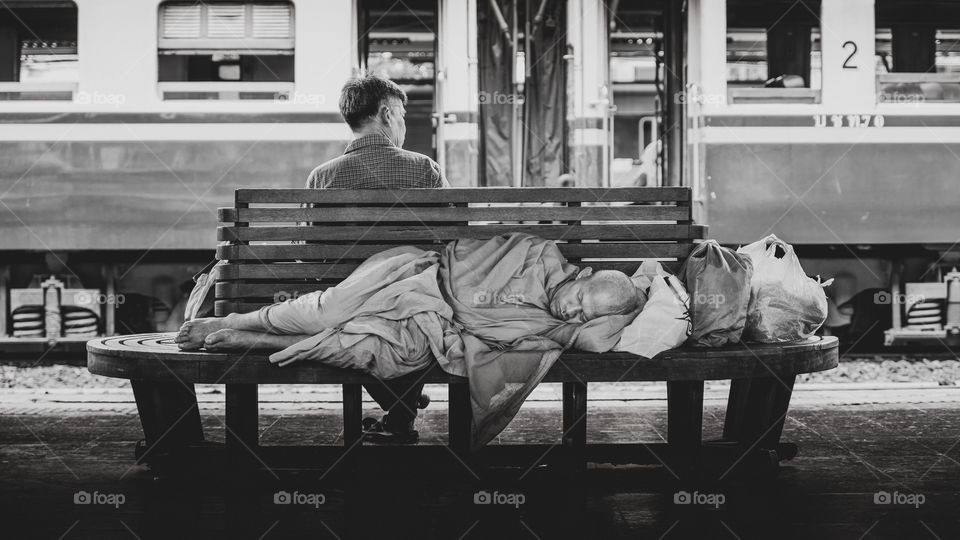 Sleeping passenger at Hua Lumphong Train Station in Bangkok Thailand