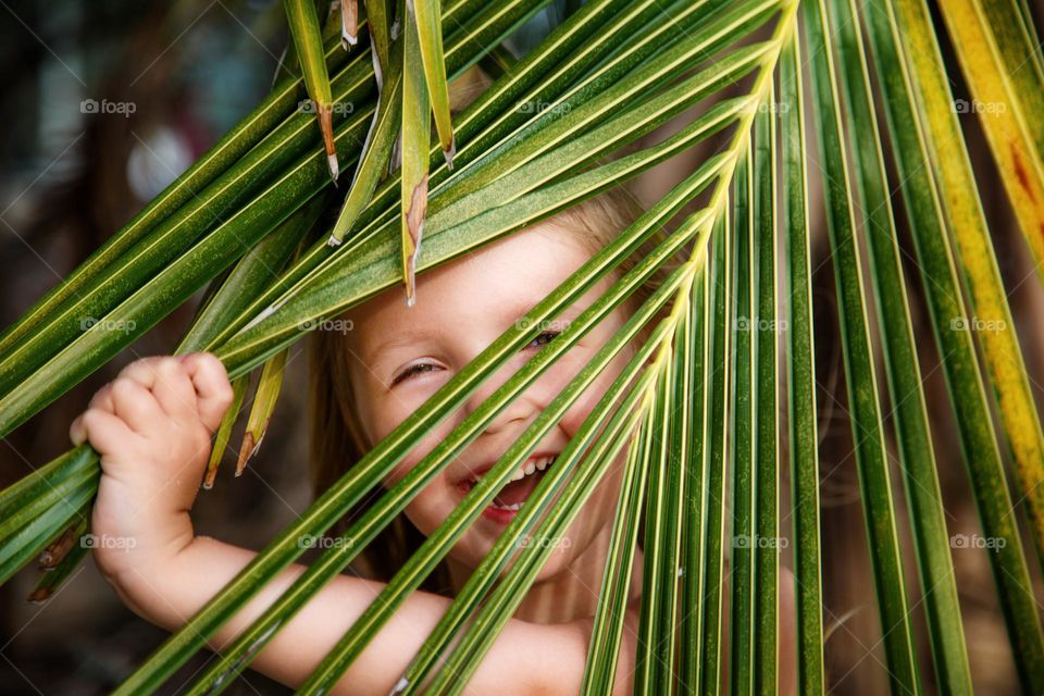 Candid portrait of happy little Caucasian girl outdoor