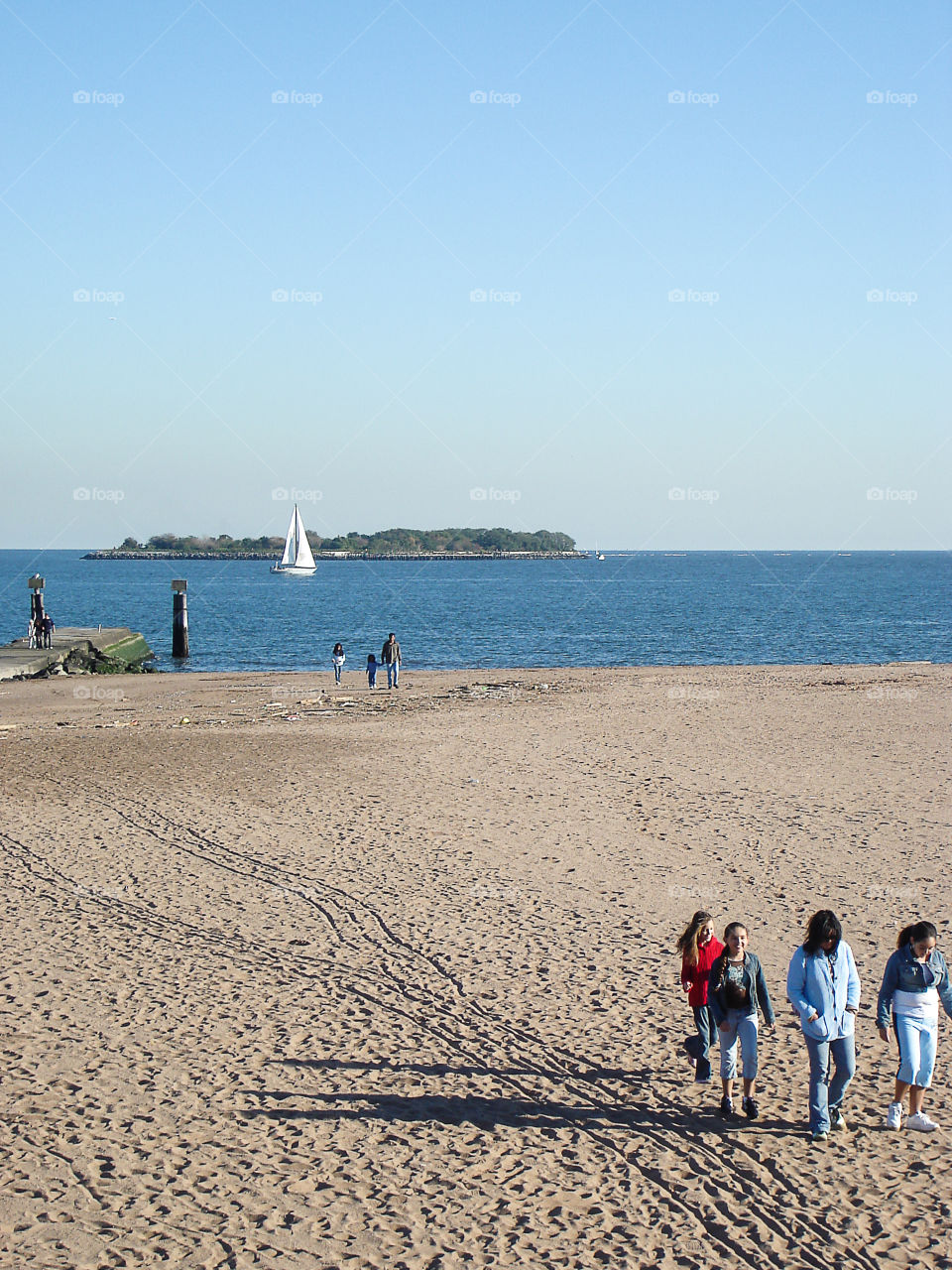 Enjoying a day on Staten Island . Kids on the shore of Staten Island