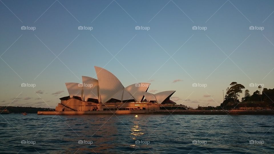 Sydney Opera House. shadow of the Harbour Bridge on the Opera House at sunset