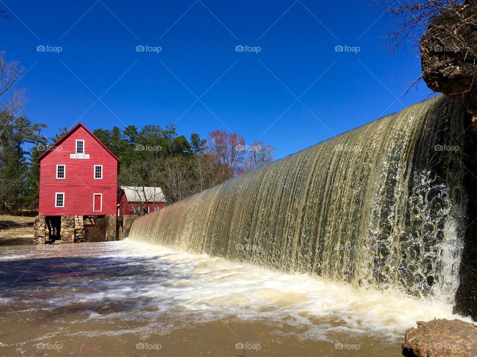 Red mill and waterfall