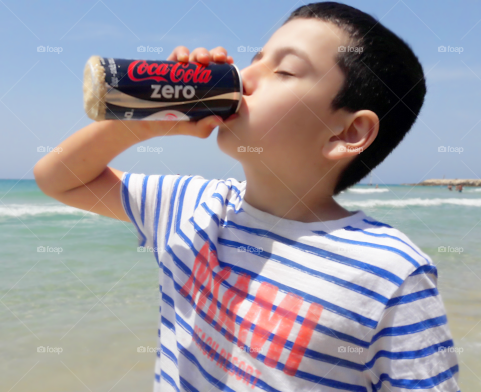 Kid drinking cola