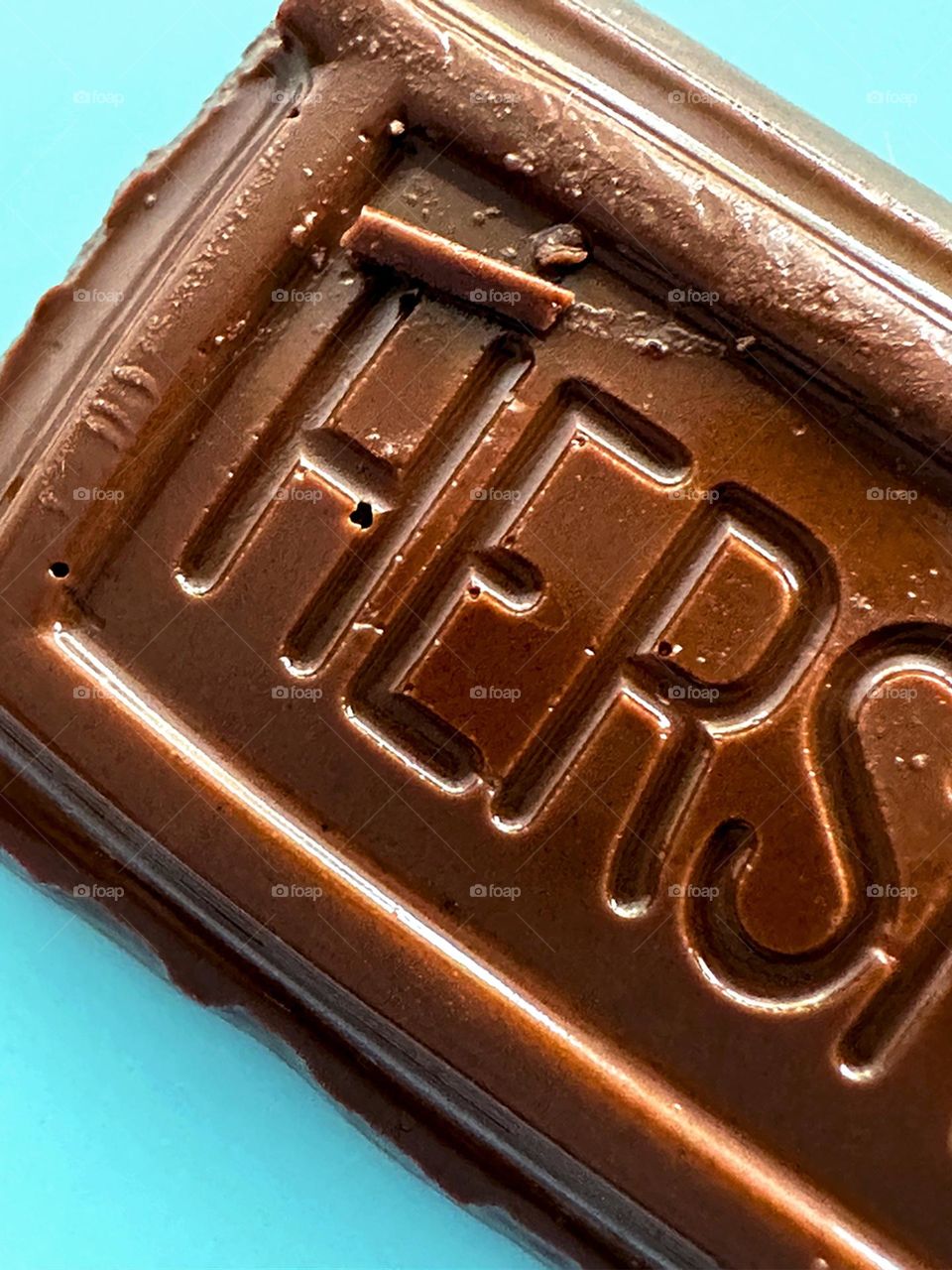 Close up of Hersheys chocolate bar on blue background 