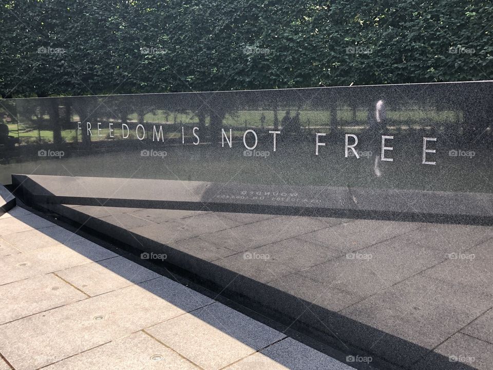 “Freedom is Not Free” engraving at the Korean War Memorial in Washington DC with reflection 