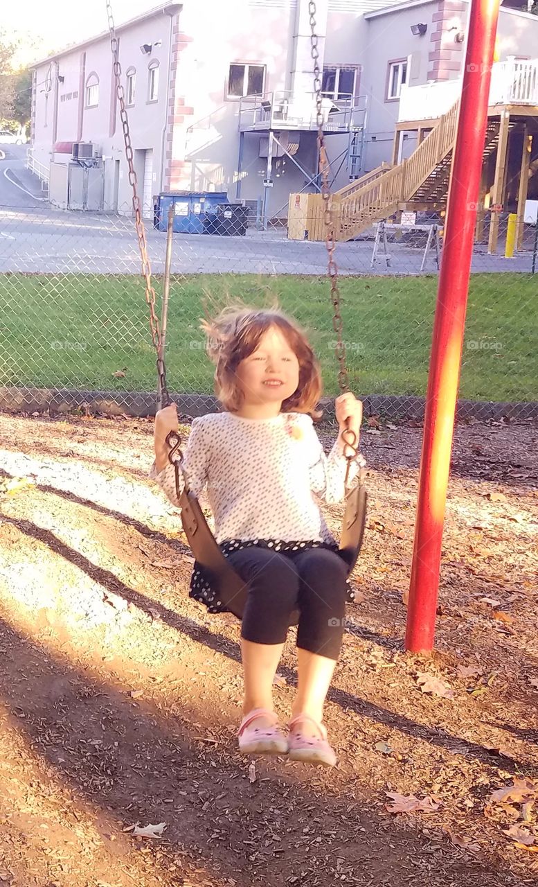 Josie on the swings