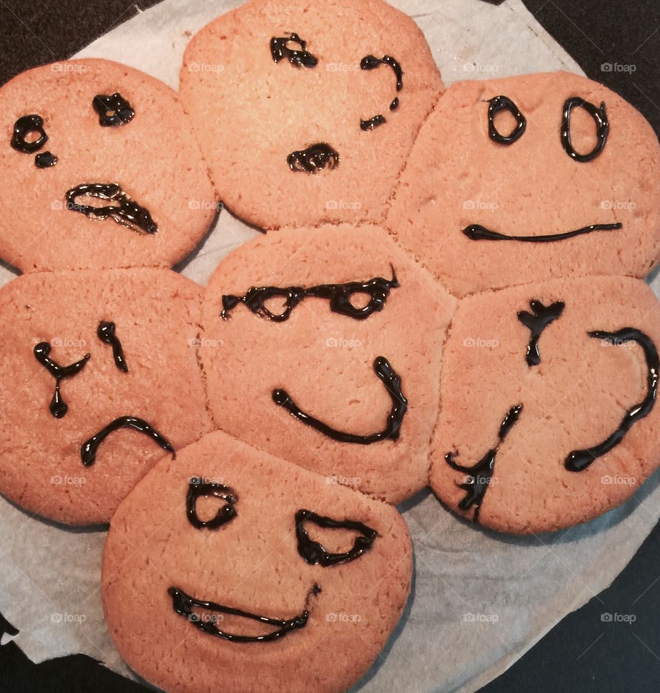 Child baked emoji cookies 