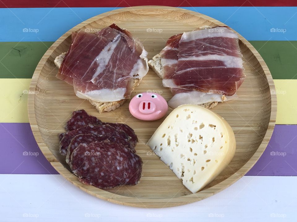 My best snack pause with ham, salami and fresh cheese over a wooden plate