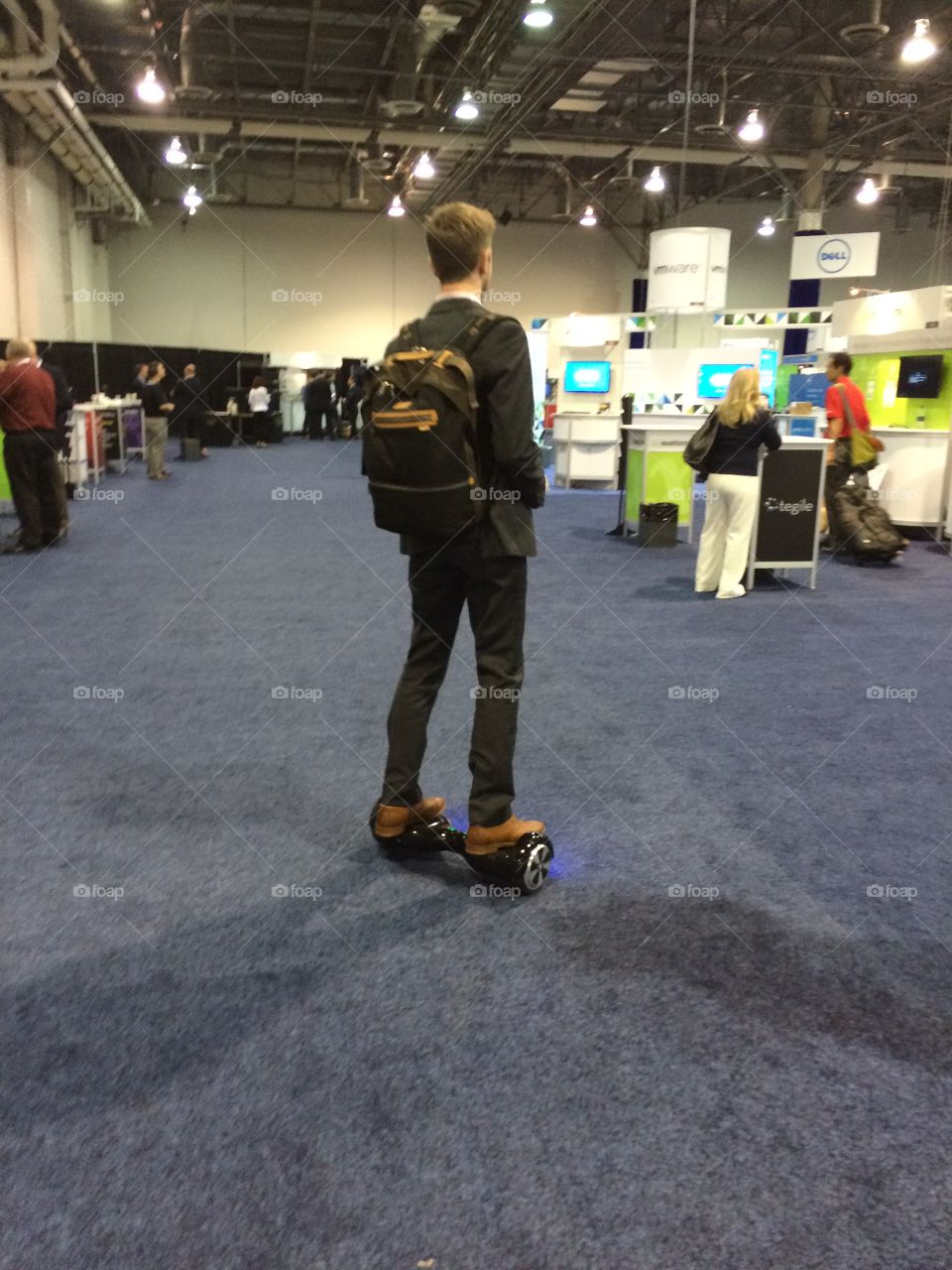 Guy on hover board at conference 